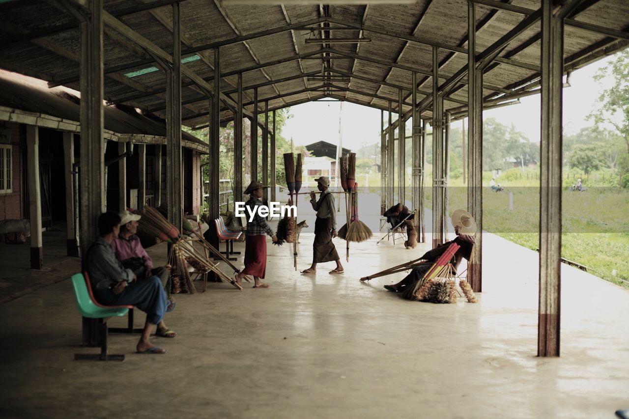 GROUP OF PEOPLE PLAYING ON SEAT IN SHOPPING MALL