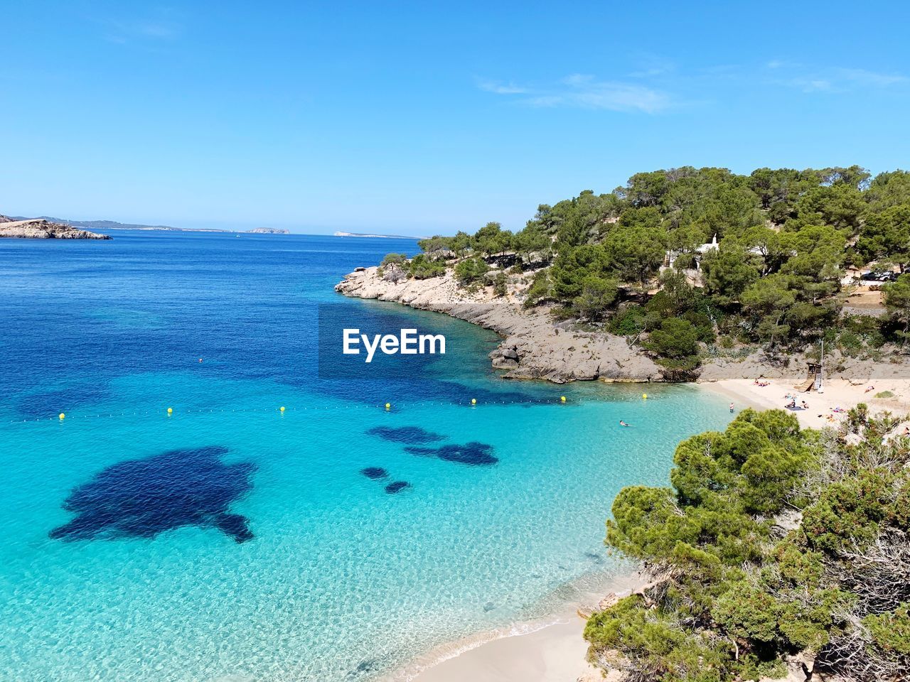 Scenic view of sea against blue sky