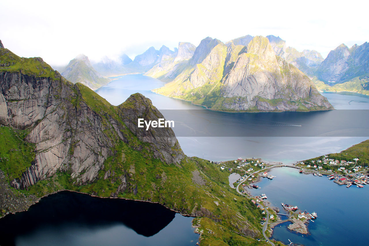 Scenic view of sea and mountains against sky in lofoten norway