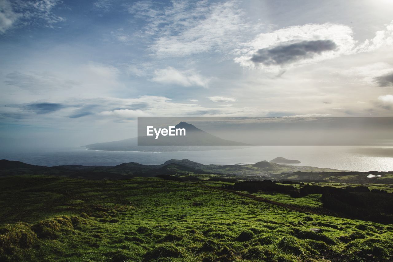 View of landscape against cloudy sky