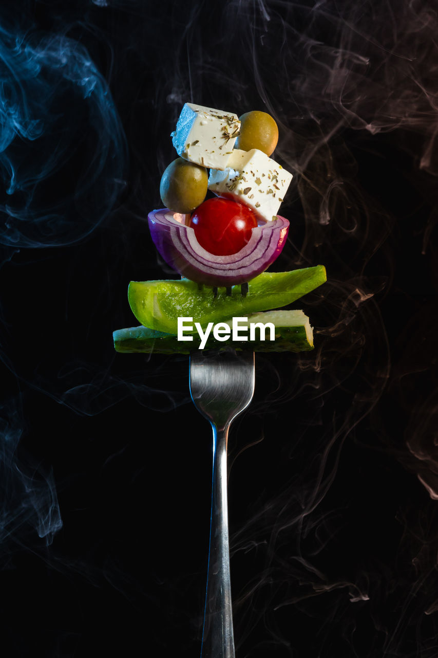high angle view of food in container against black background