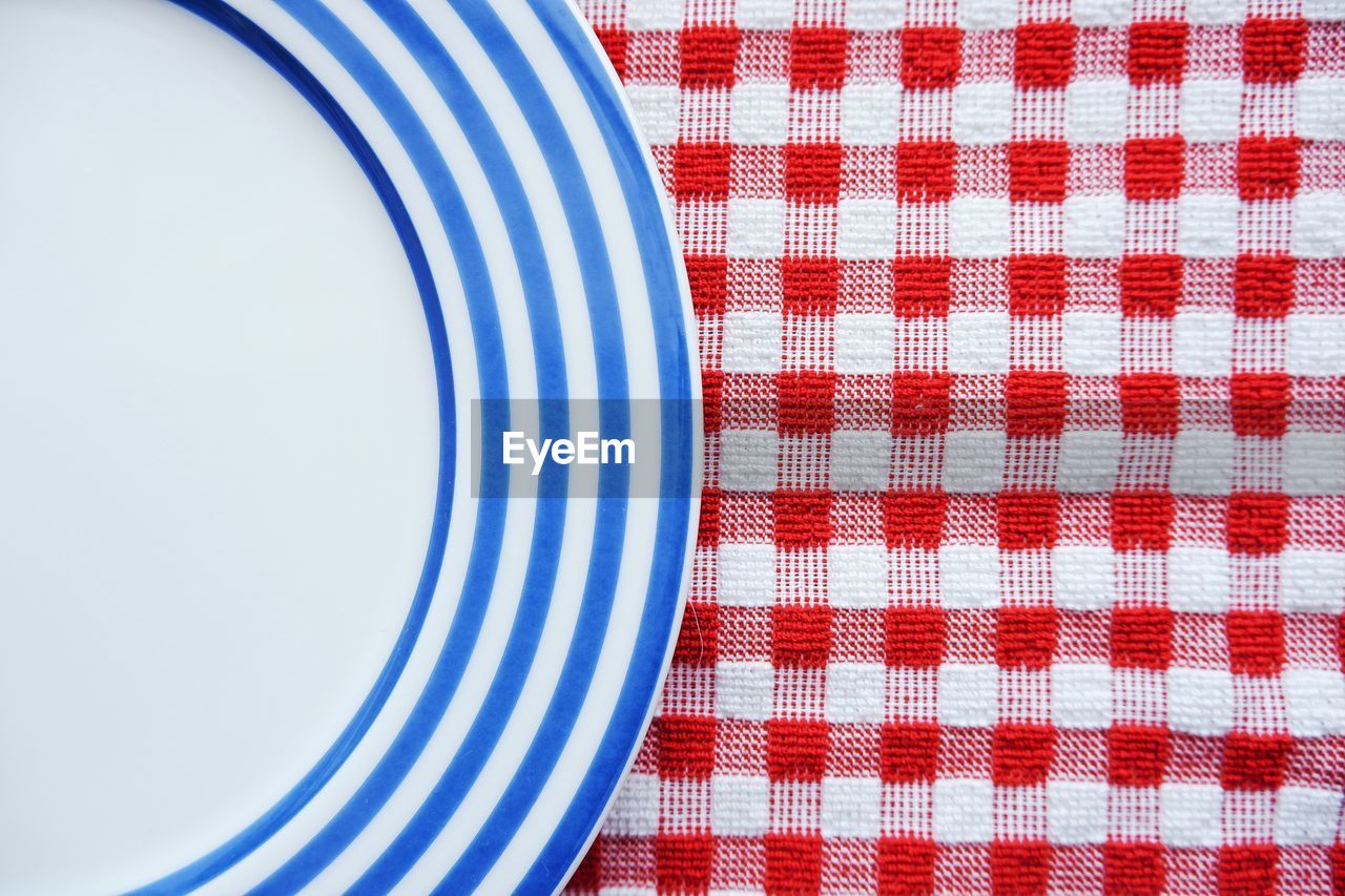 High angle view of white plate on table