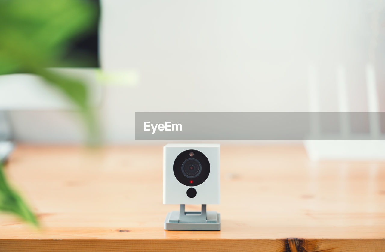 Close-up of camera on table at home