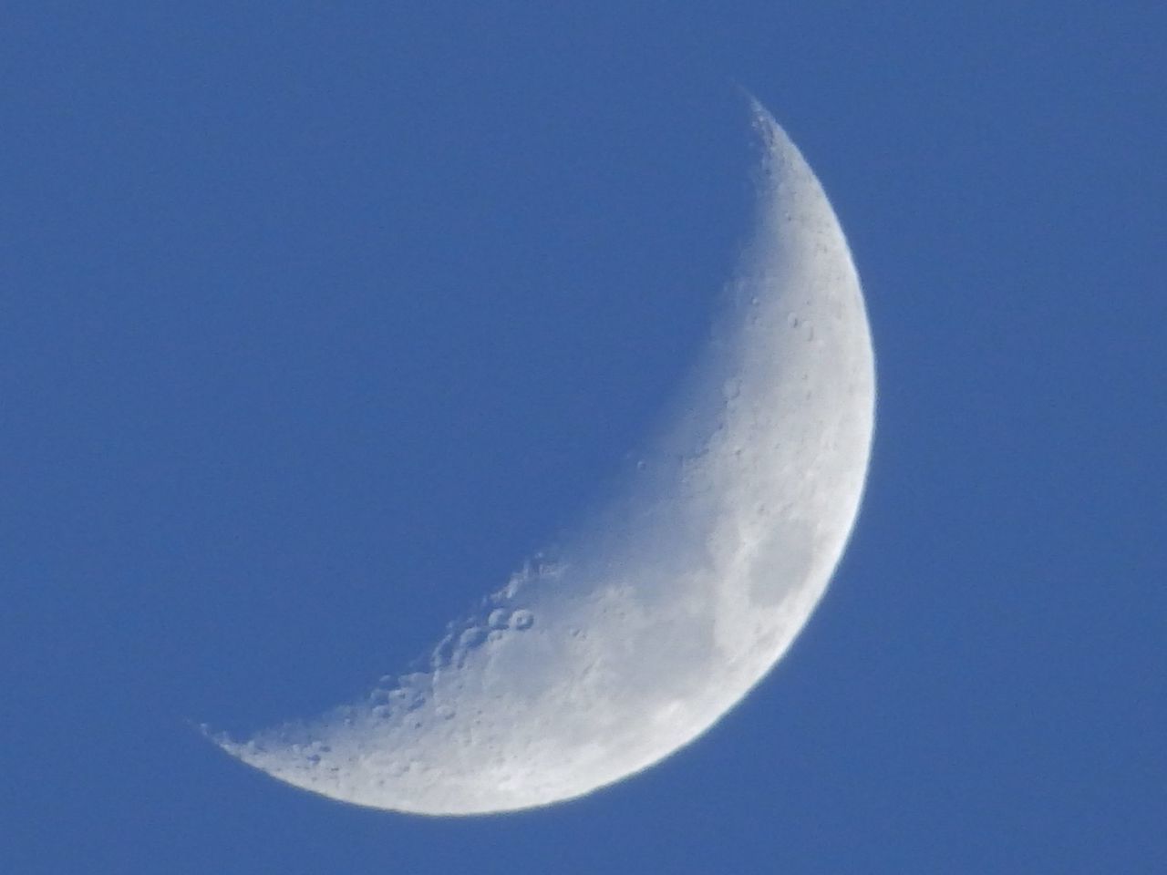 MOON IN BLUE SKY