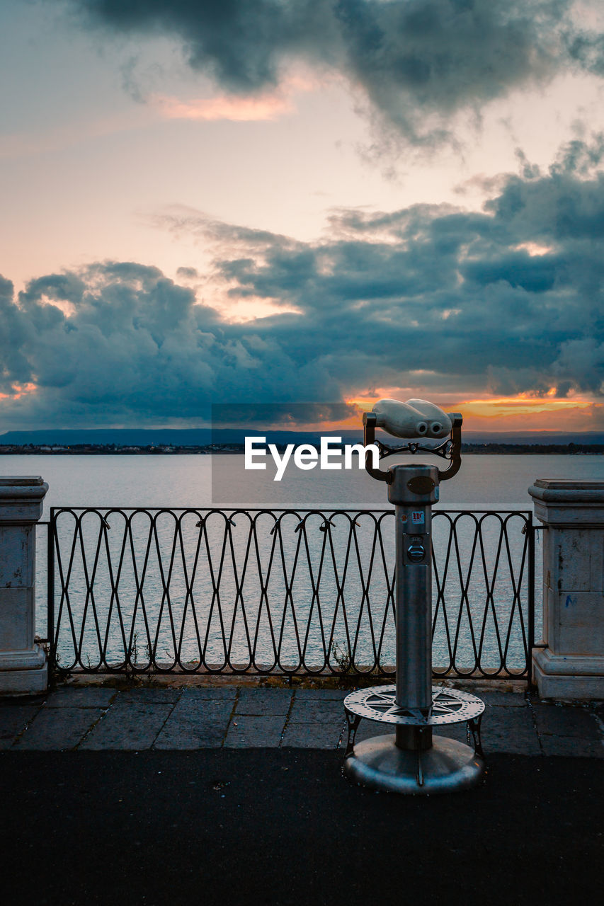 Panoramic sea binoculars with spectacular sunset in the background