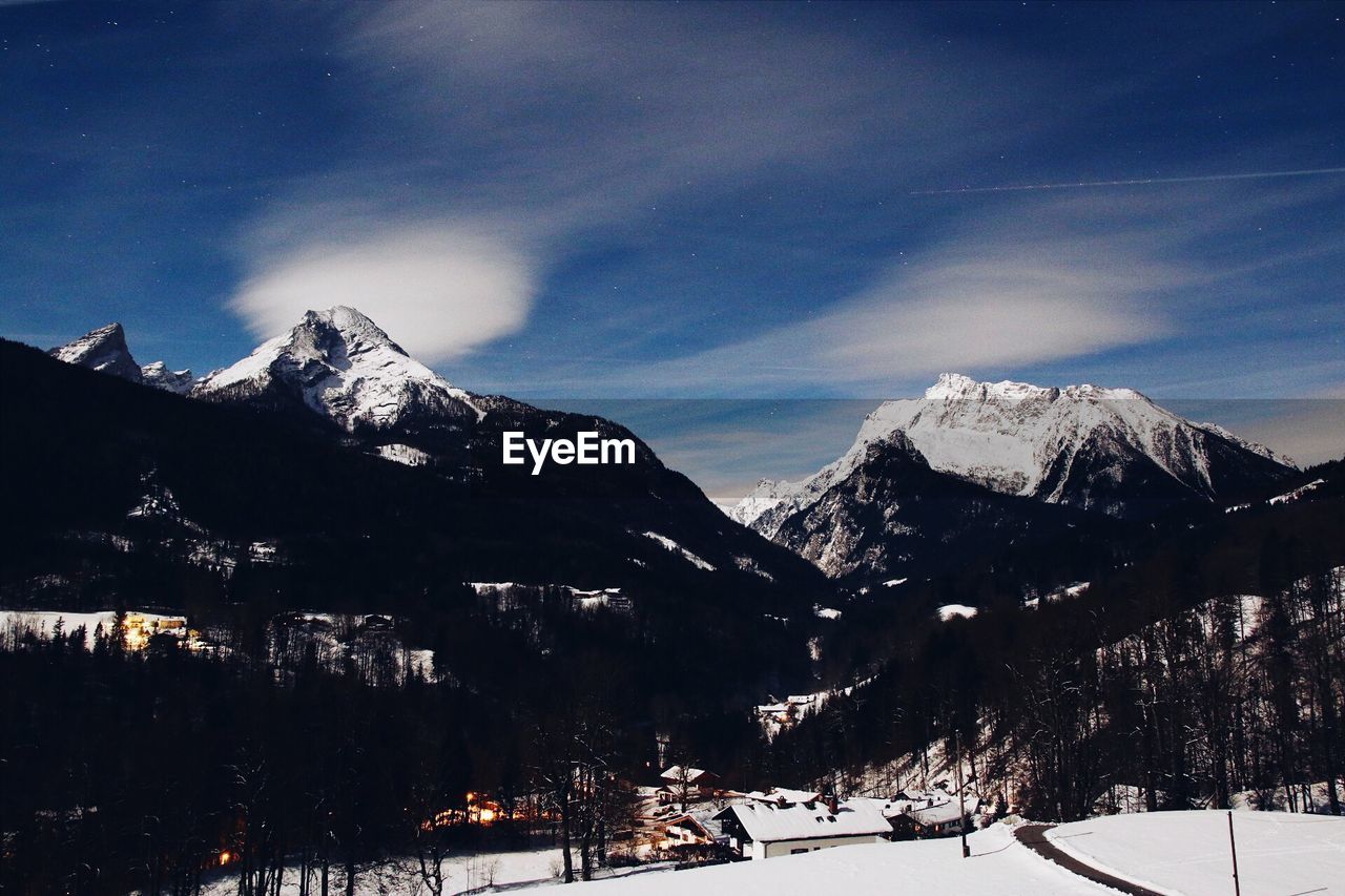 SCENIC VIEW OF SNOWCAPPED MOUNTAINS AGAINST SKY DURING WINTER