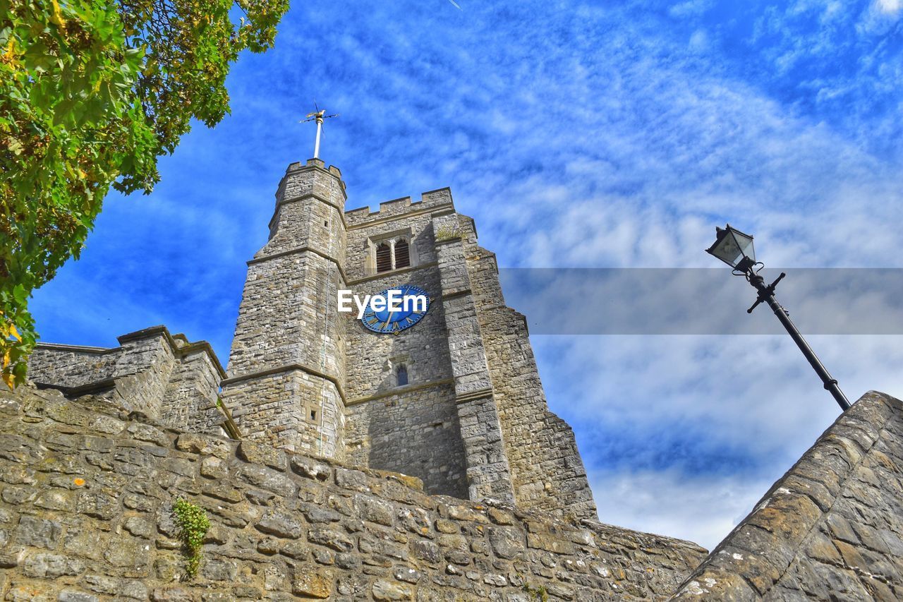 LOW ANGLE VIEW OF CATHEDRAL AGAINST BLUE SKY