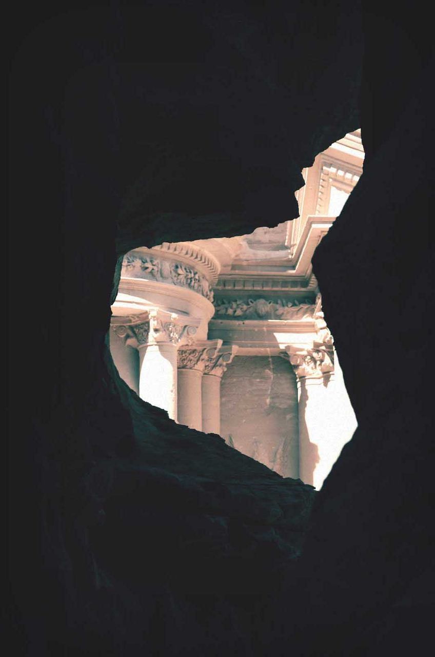 Ancient temple building through stone cave