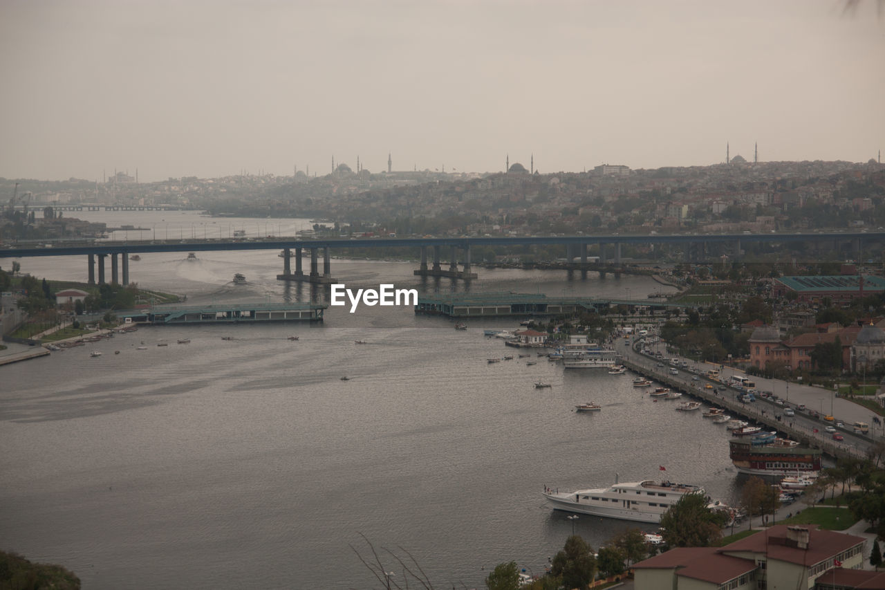 High angle view of bridge over river in city against clear sky