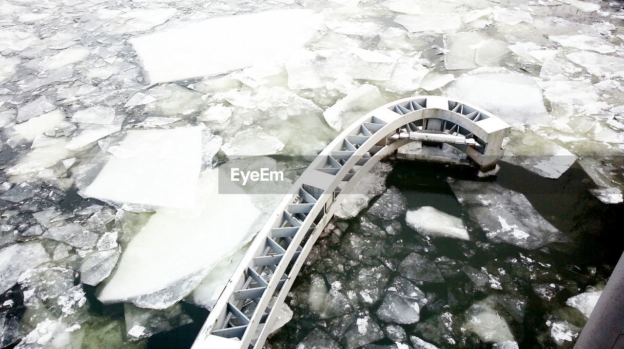 High angle view of metal structure in frozen lake
