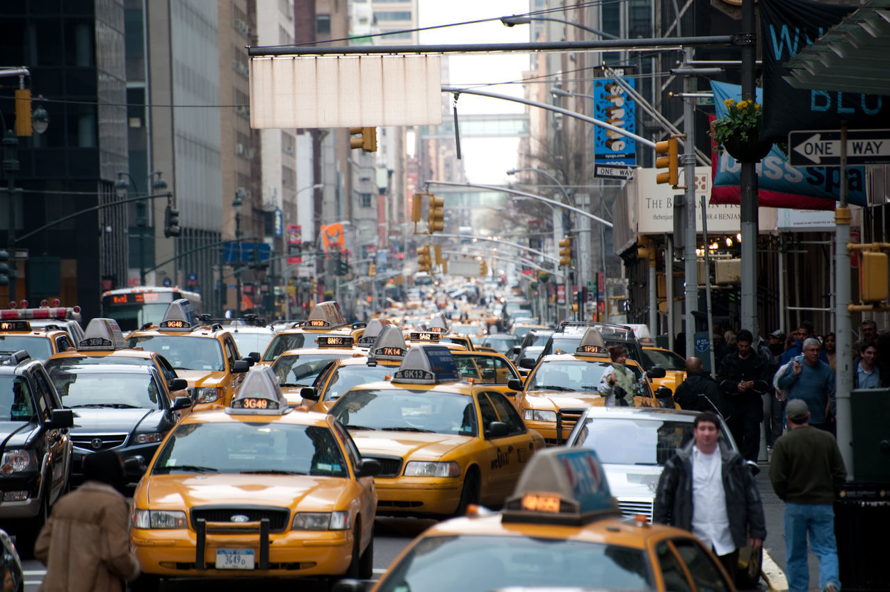 View of taxis on city street