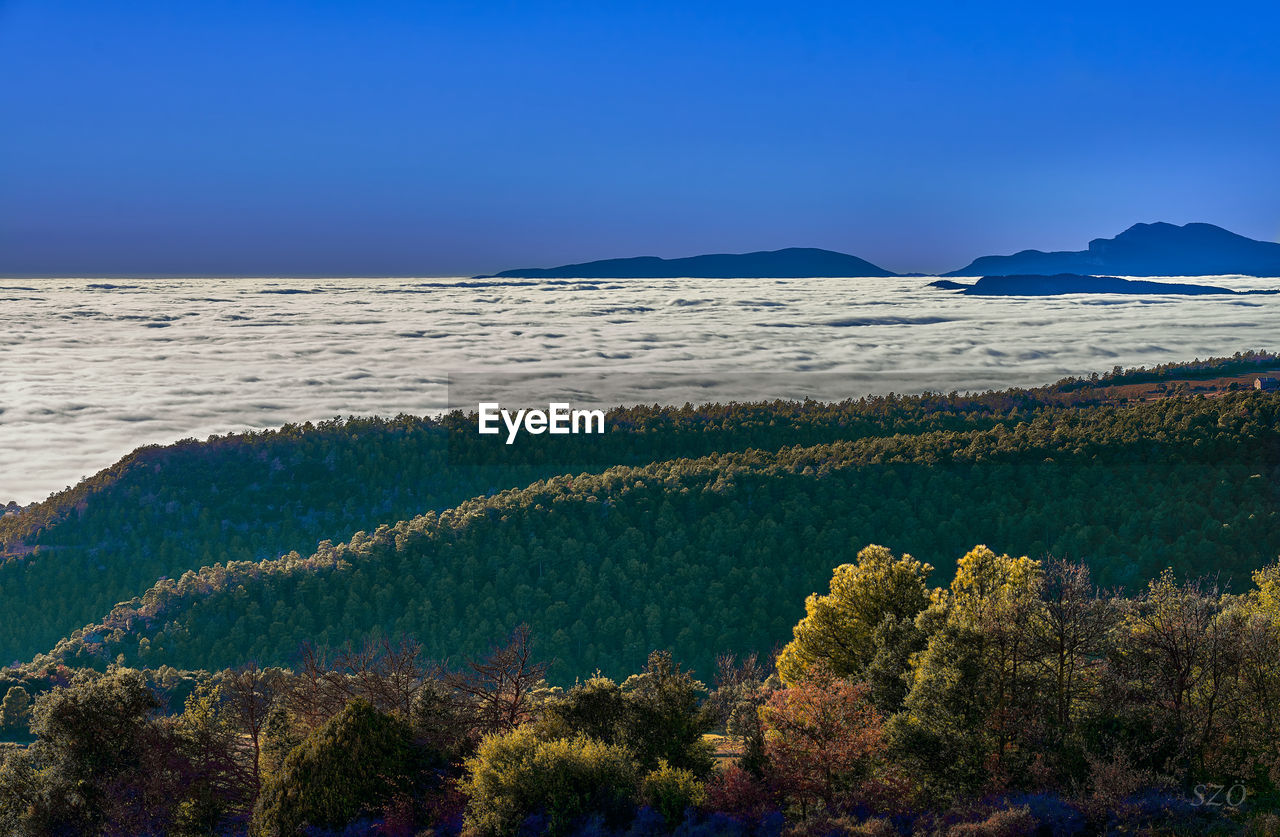 SCENIC VIEW OF LAND AGAINST BLUE SKY