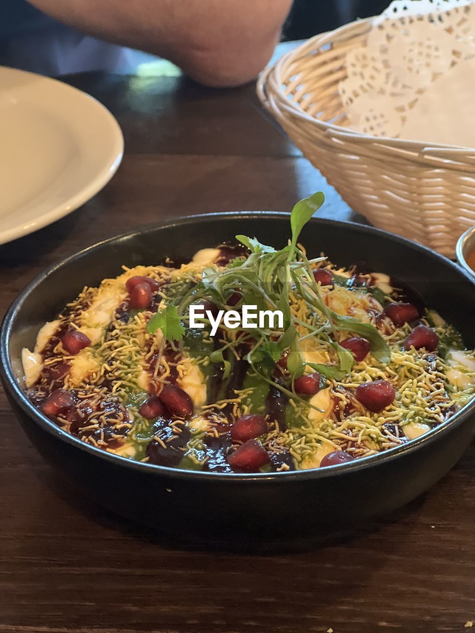 food and drink, food, healthy eating, freshness, tableware, table, wellbeing, dish, plate, indoors, directly above, high angle view, produce, vegetable, meal, wood, bowl, hand, fast food, herb, one person, fruit, lifestyles, kitchen utensil, plant, platter, salad