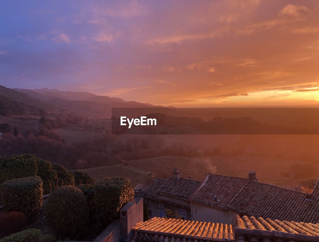 High angle view of townscape against sky during sunset