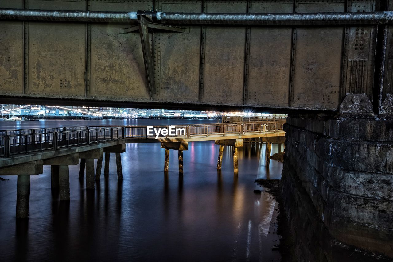 Bridges over river at dusk