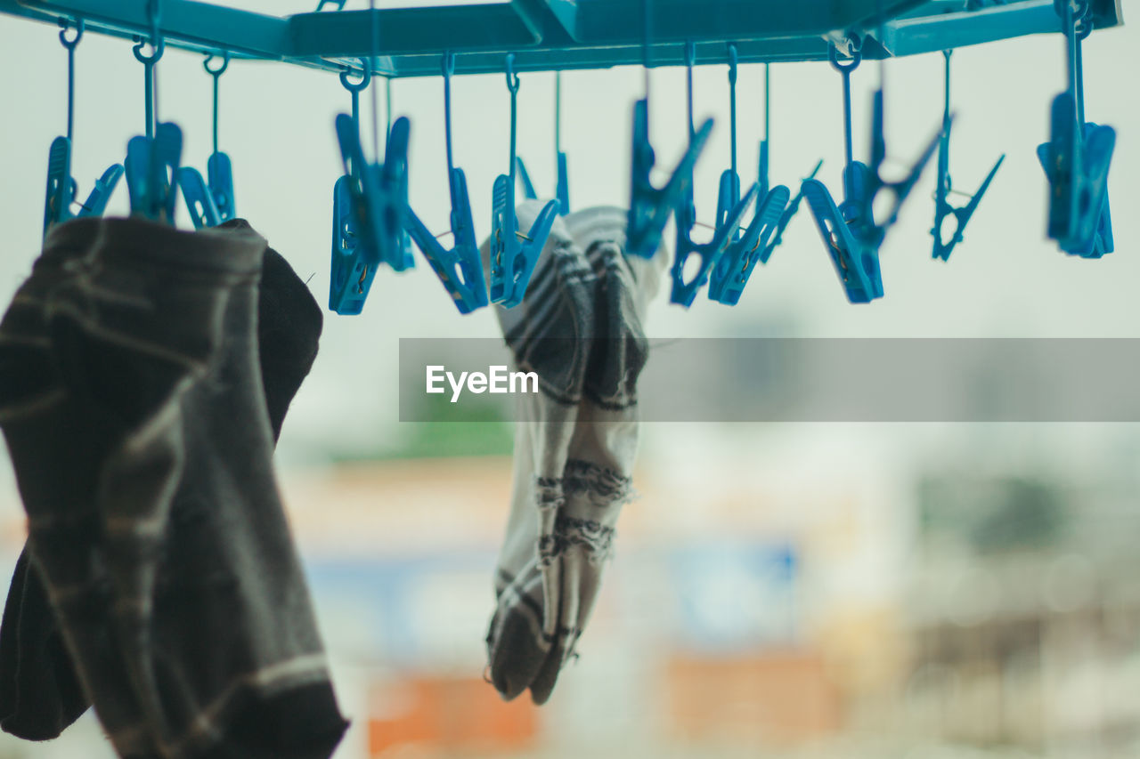 Close-up of clothes hanging on clothesline