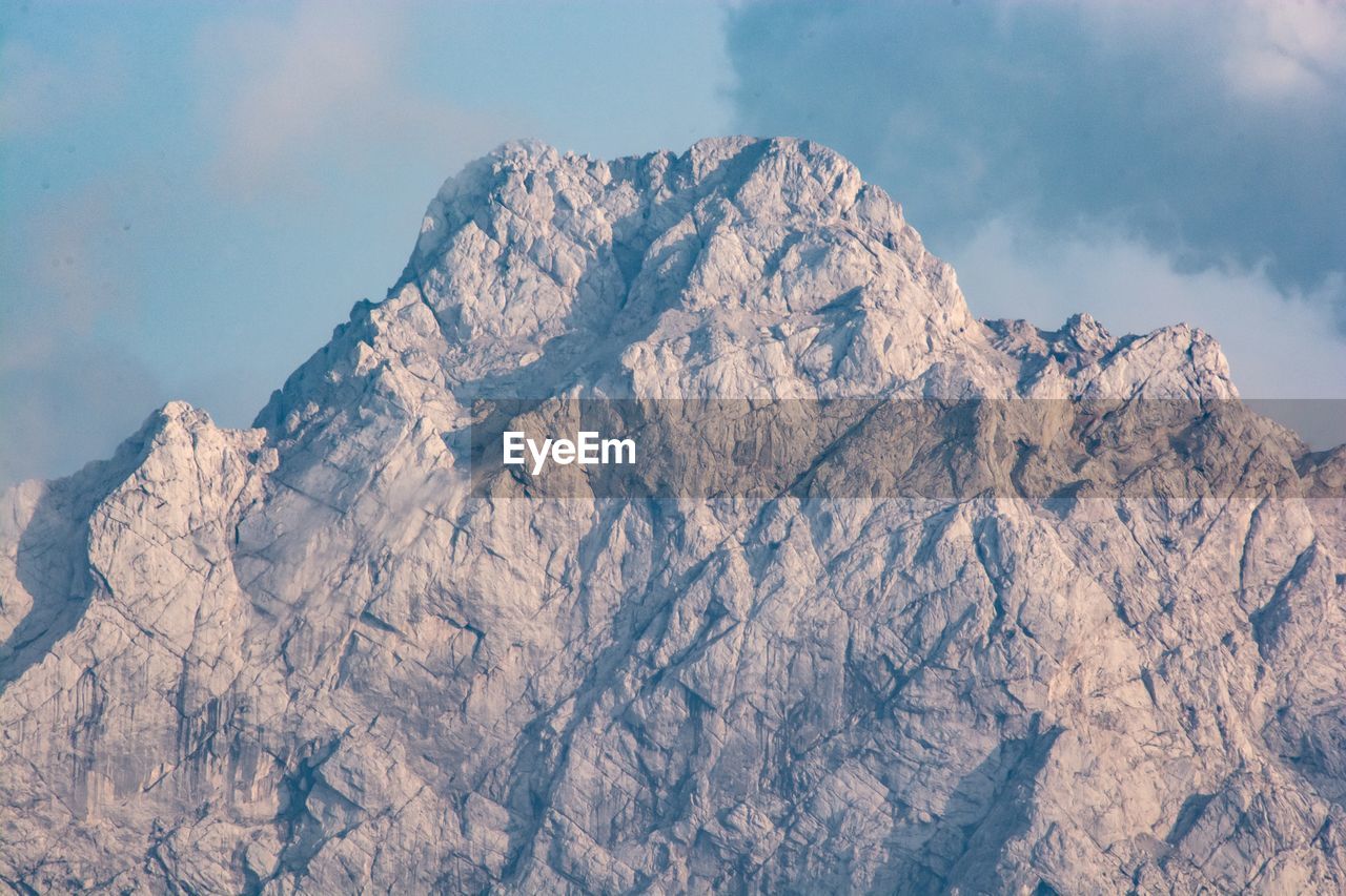 Low angle view of rock formation against sky