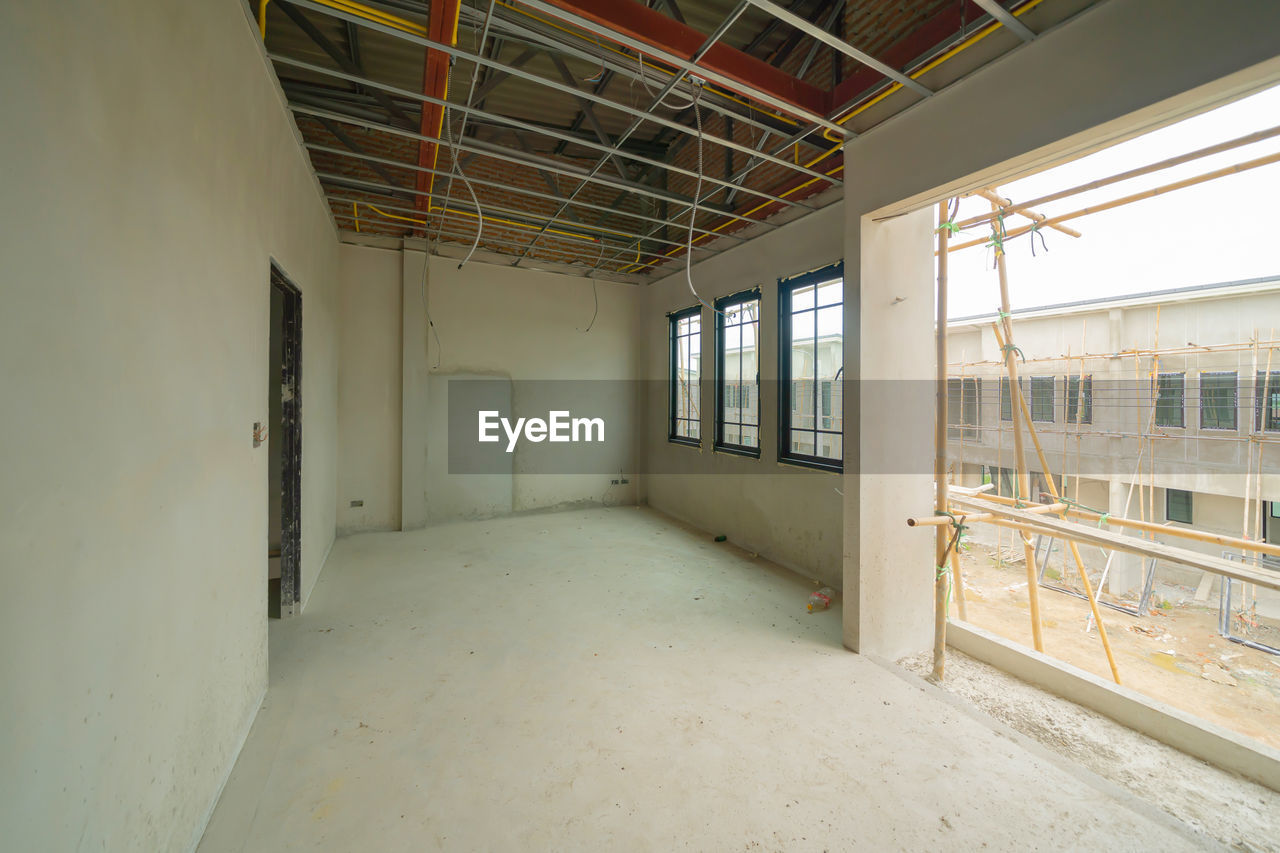 architecture, indoors, window, home, room, building, built structure, floor, no people, house, construction industry, abandoned, industry, real estate, domestic room, home interior, wood, construction site, estate, flooring, ceiling, day, interior design, hall, empty, wall - building feature