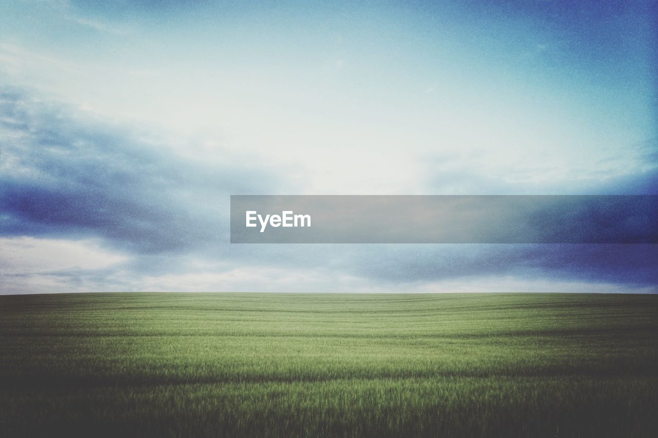 Countryside landscape against blue sky and clouds