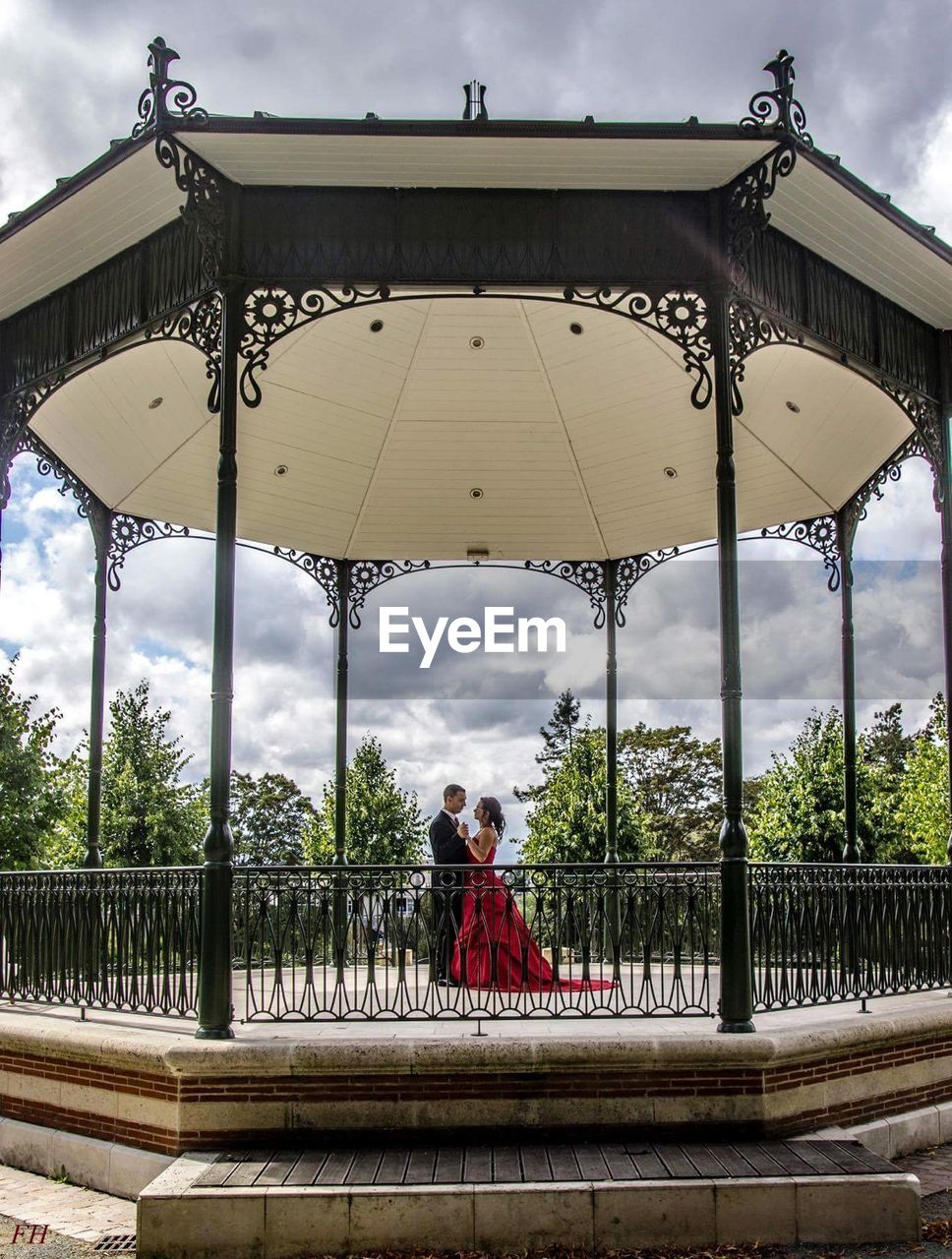 Couple dancing in gazebo