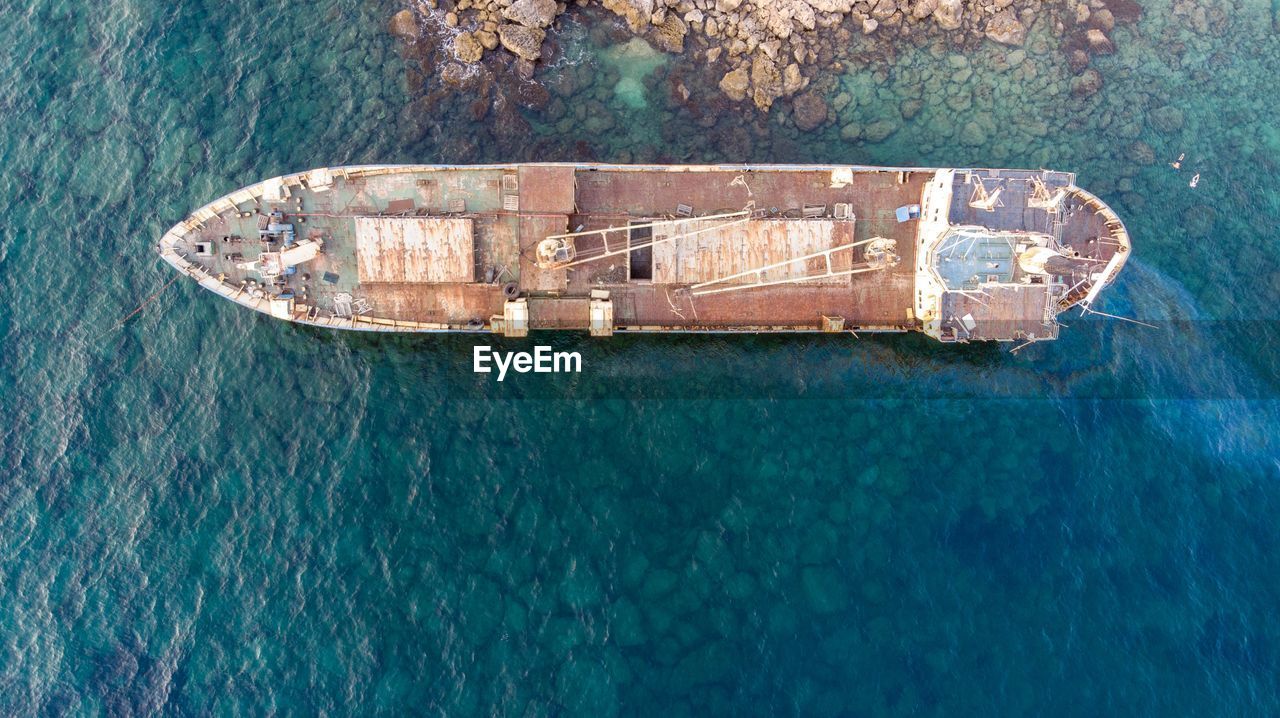 Directly above shot of shipwreck on sea