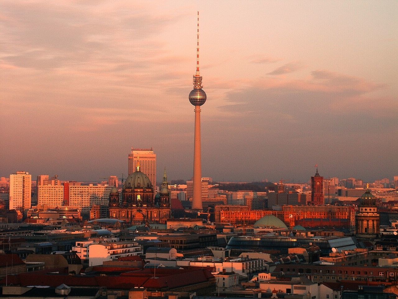 Communications tower in city at night