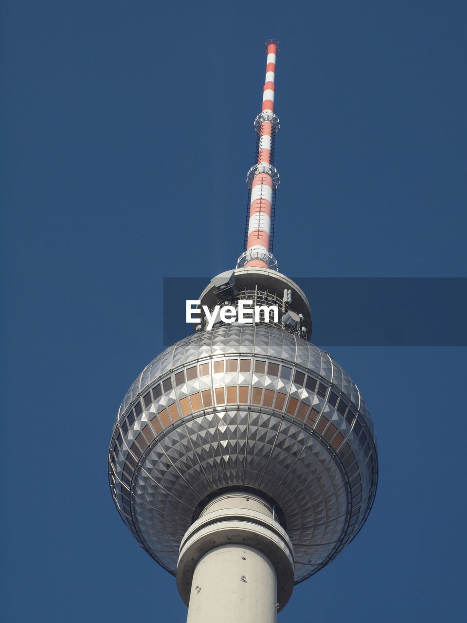 Low angle view of tower against blue sky