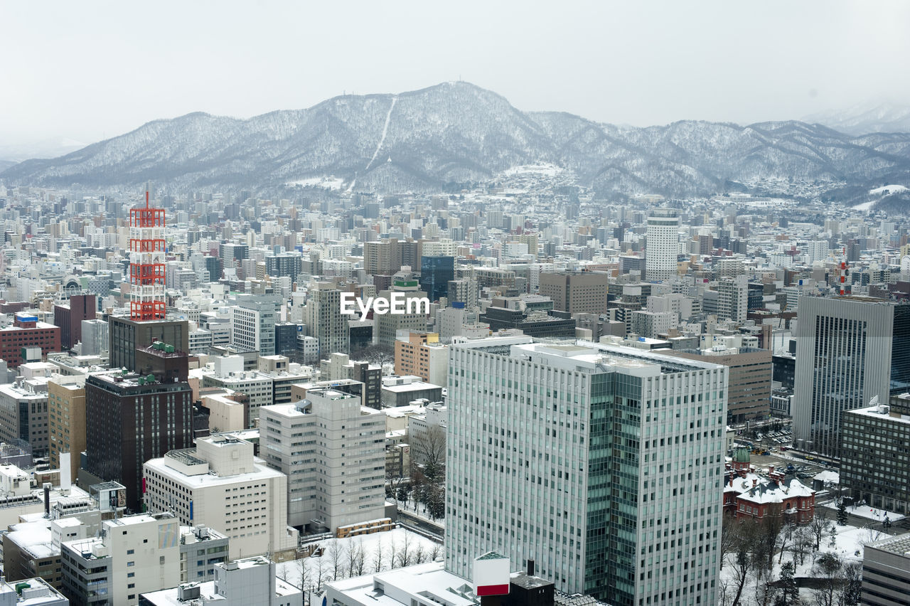 Cityscape with mountain range in background