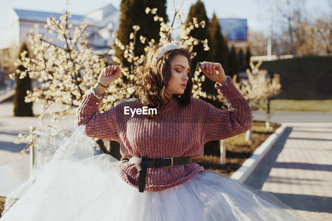 Young woman posing outdoors