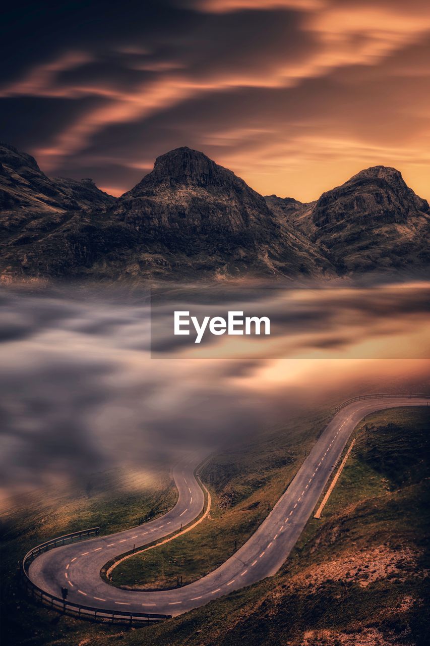 Scenic view of mountains against sky during sunset