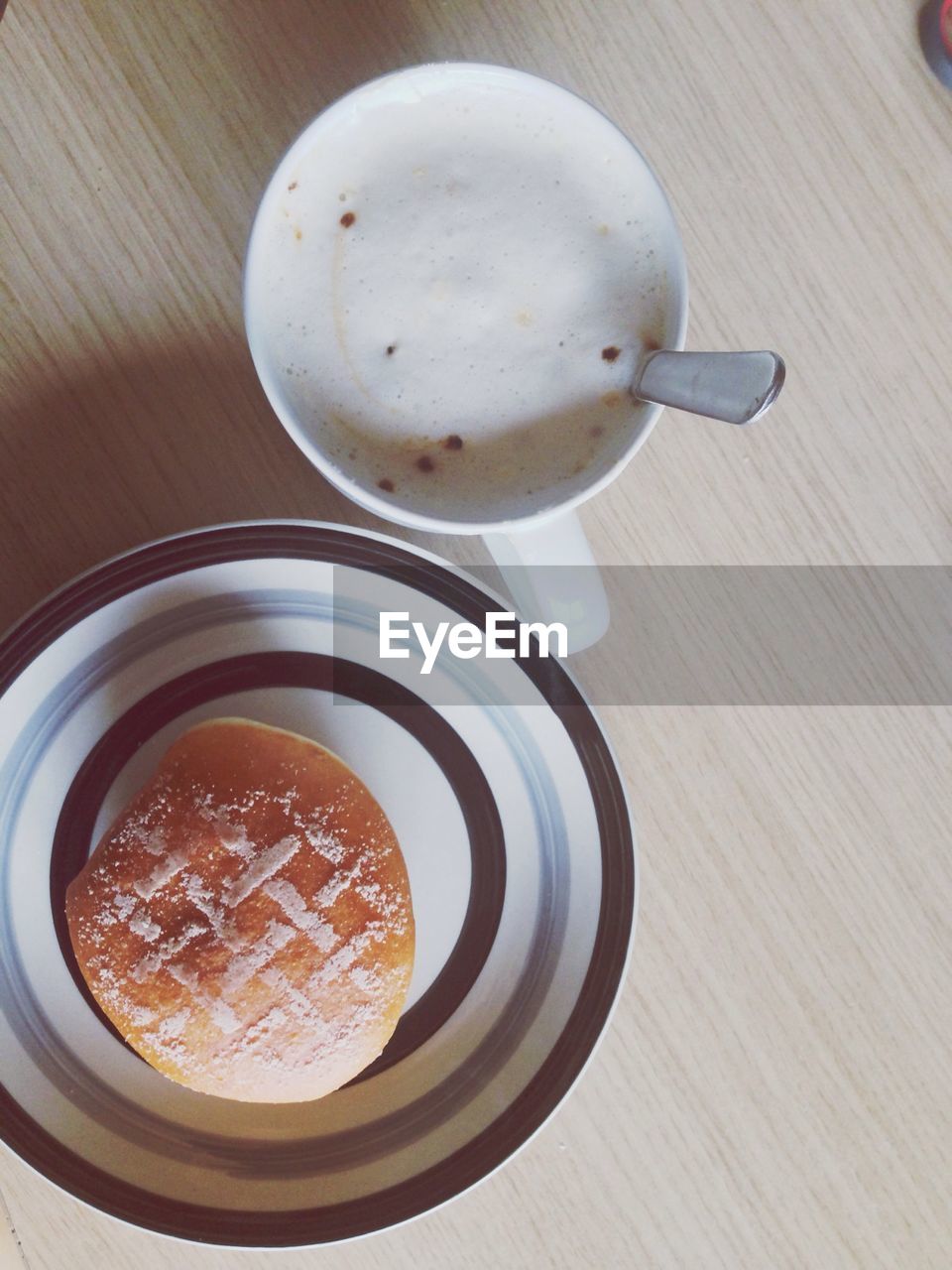 High angle view of breakfast on wooden table