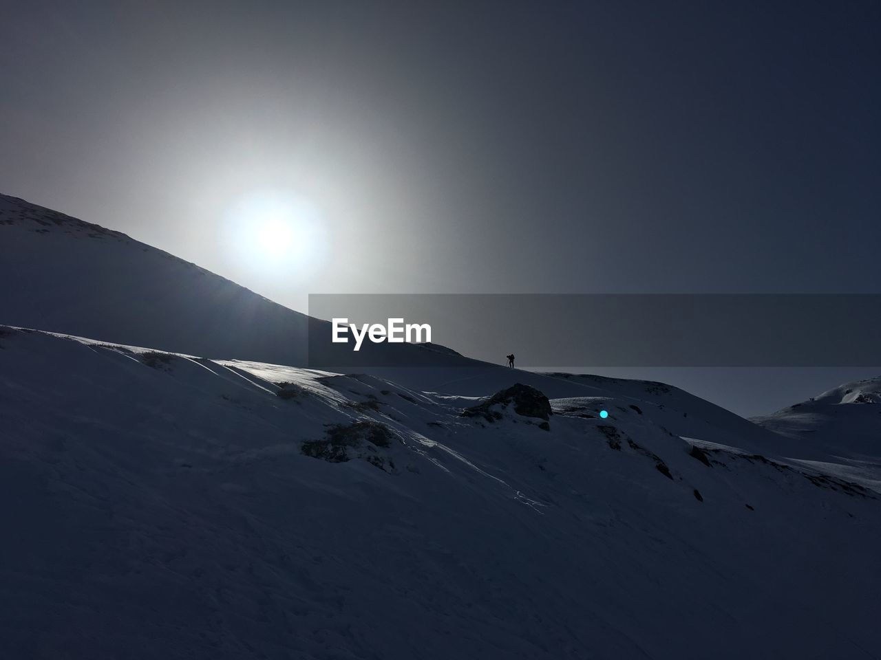 SNOW COVERED MOUNTAIN AGAINST SKY