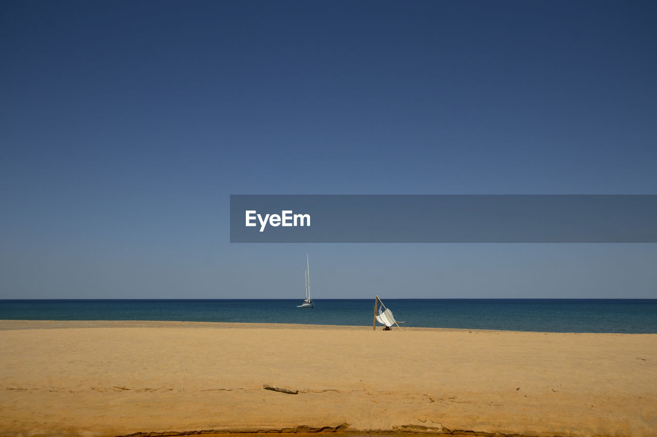 Landscape view of piscinas beach with a sail and tourist