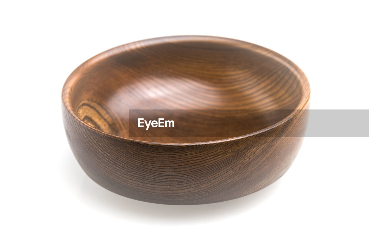 Wooden bowl against white background