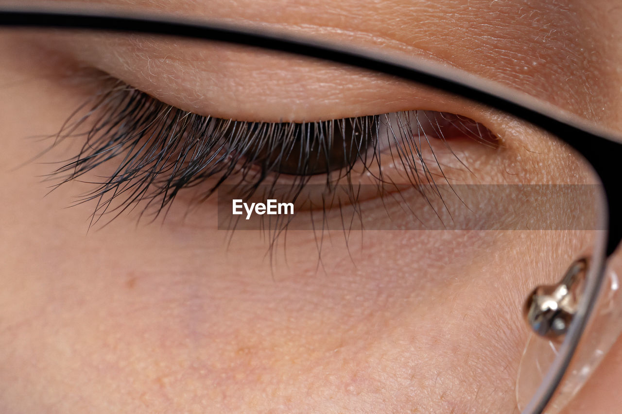 Close-up of girl face wearing eyeglasses