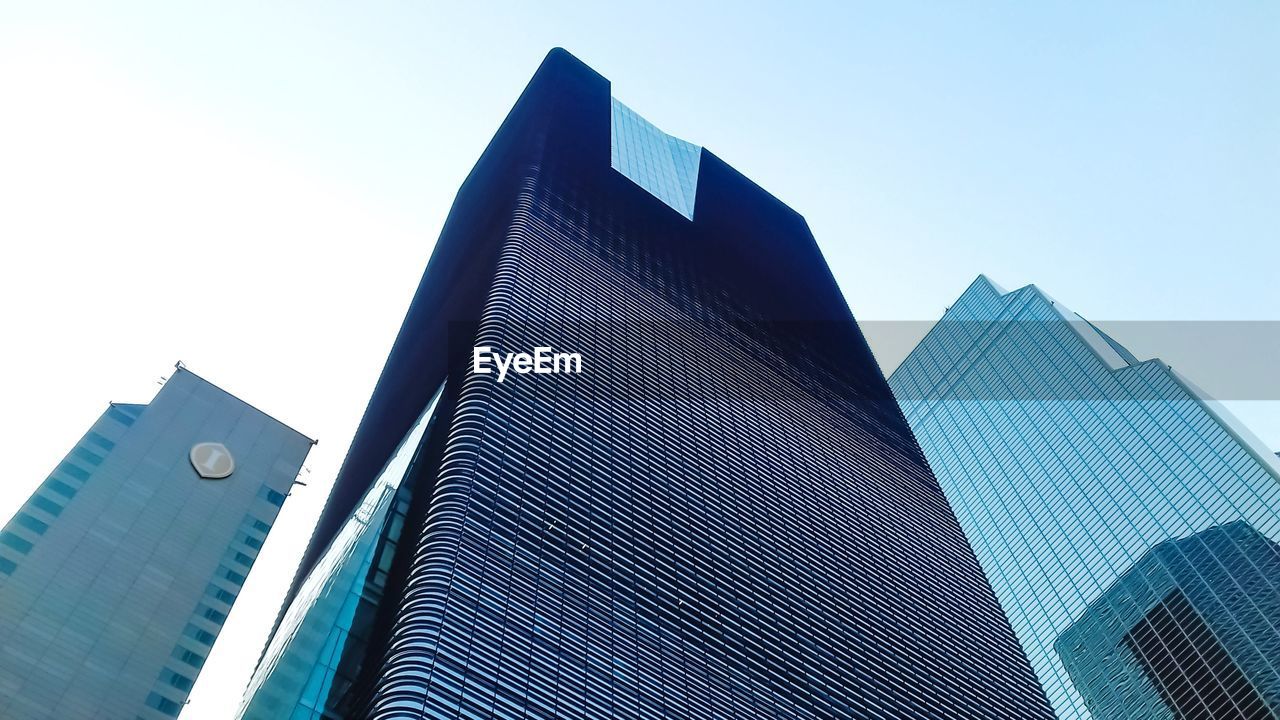 Low angle view of modern building against clear sky