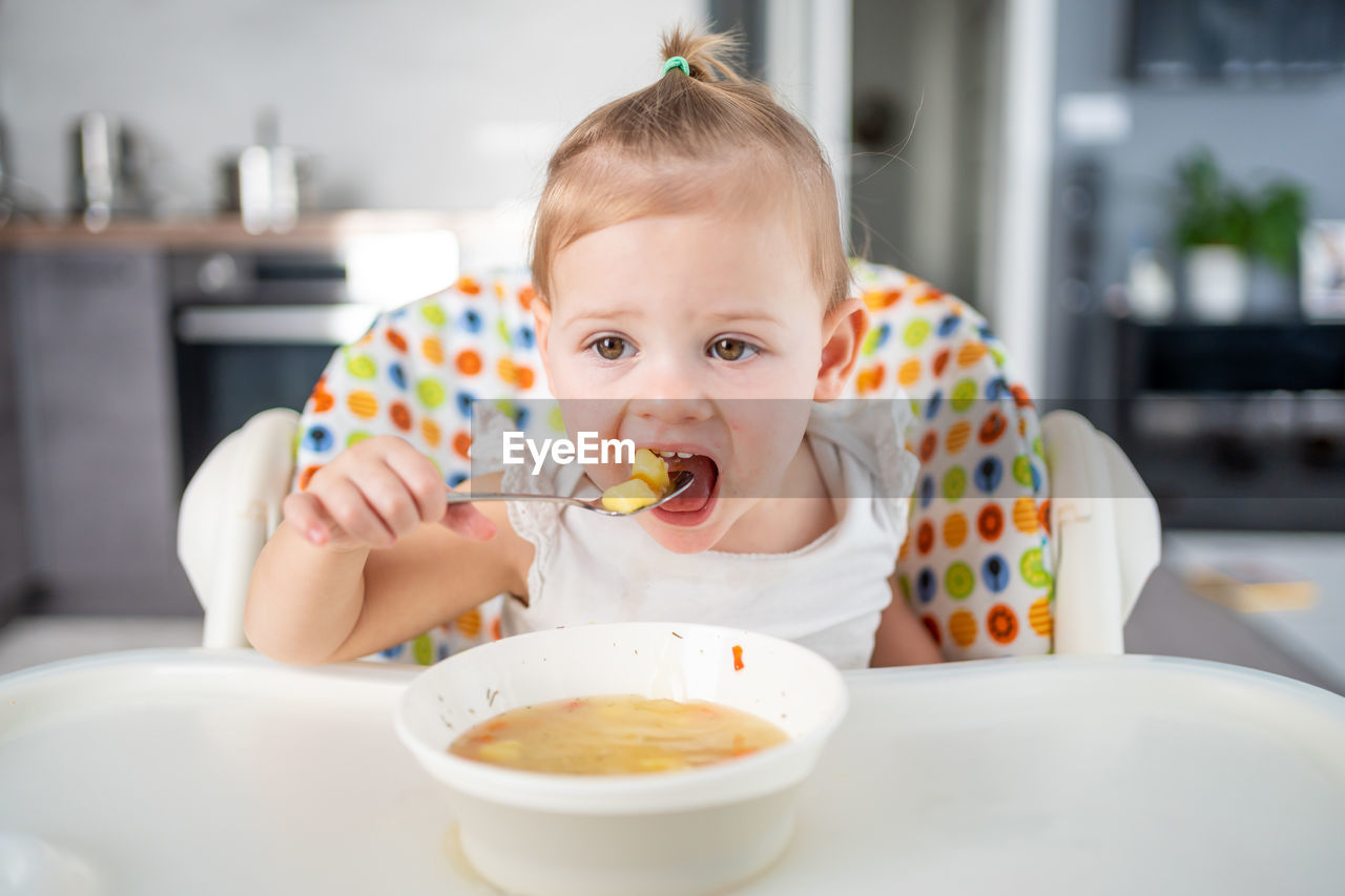 close-up of cute boy eating food