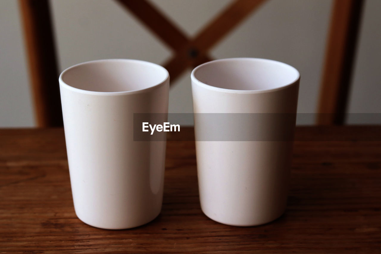 CLOSE-UP OF CUP OF COFFEE ON TABLE