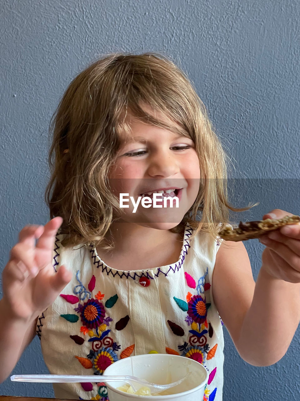 Portrait of smiling girl holding ice cream