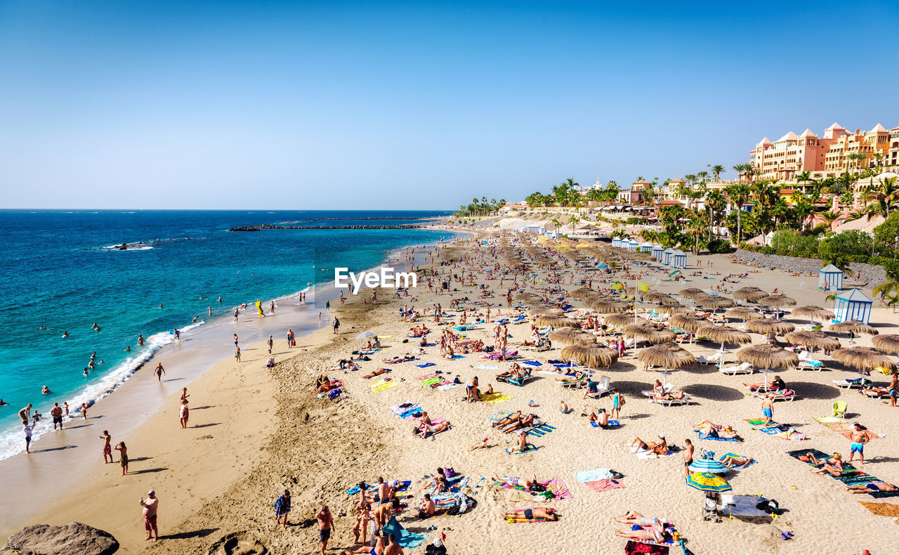 HIGH ANGLE VIEW OF PEOPLE AT BEACH