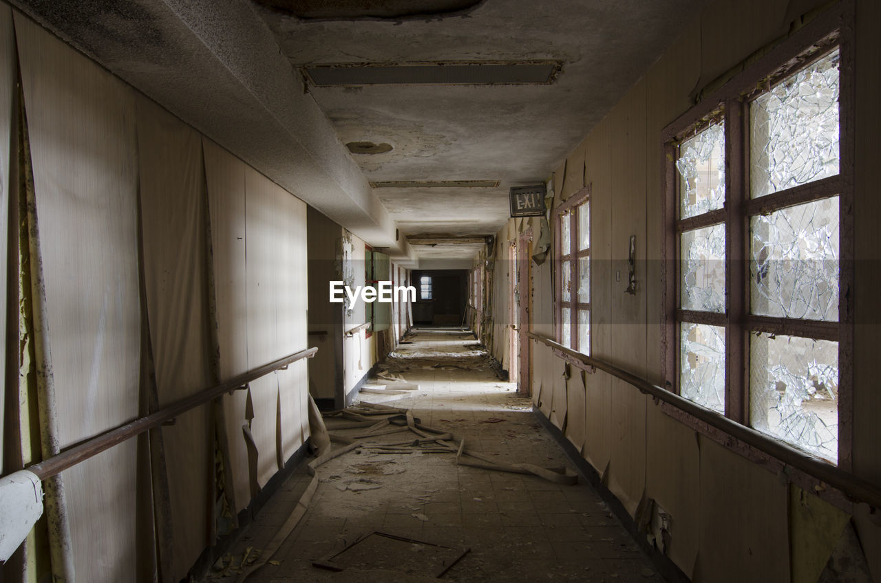 EMPTY CORRIDOR OF ABANDONED BUILDING