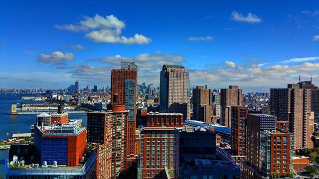 VIEW OF CITYSCAPE AGAINST BLUE SKY