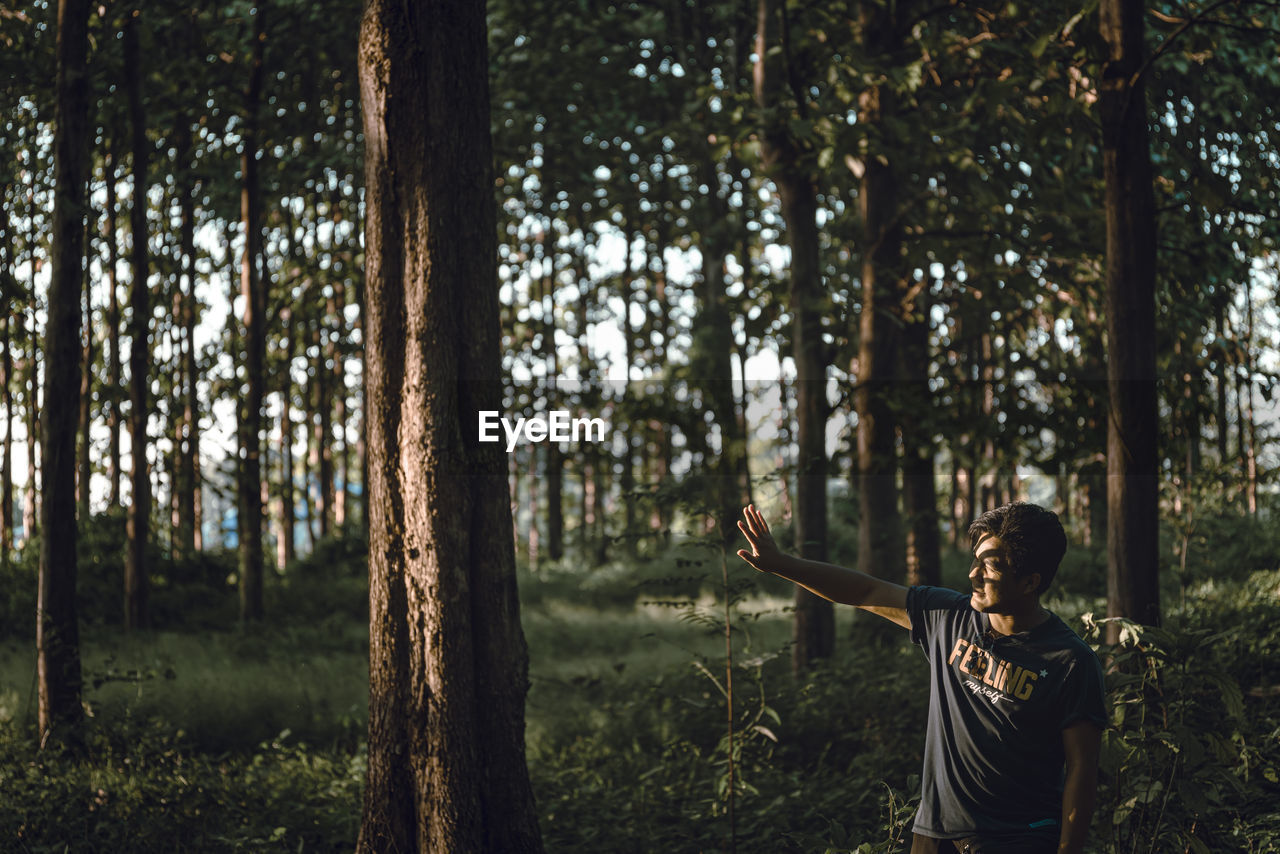 Man standing in forest