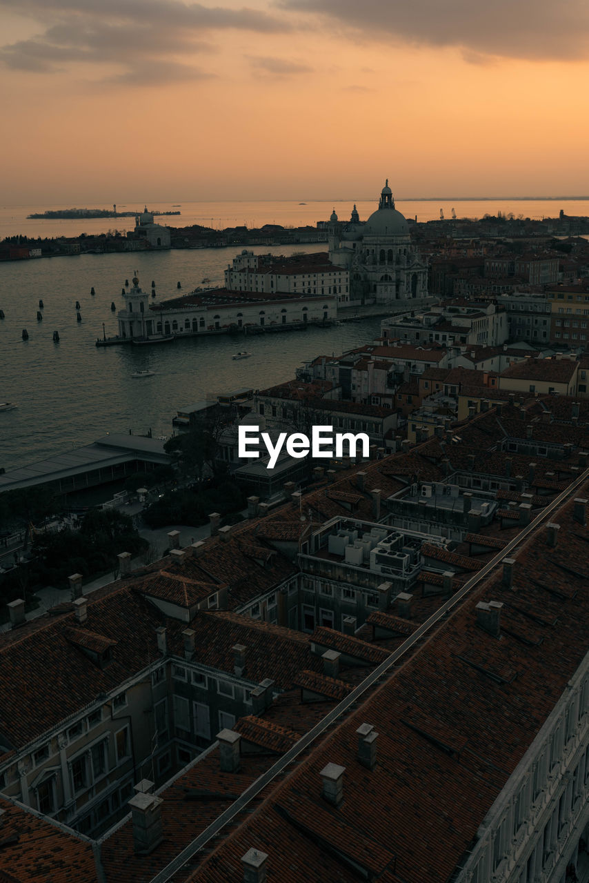 High angle view of buildings against sky during sunset