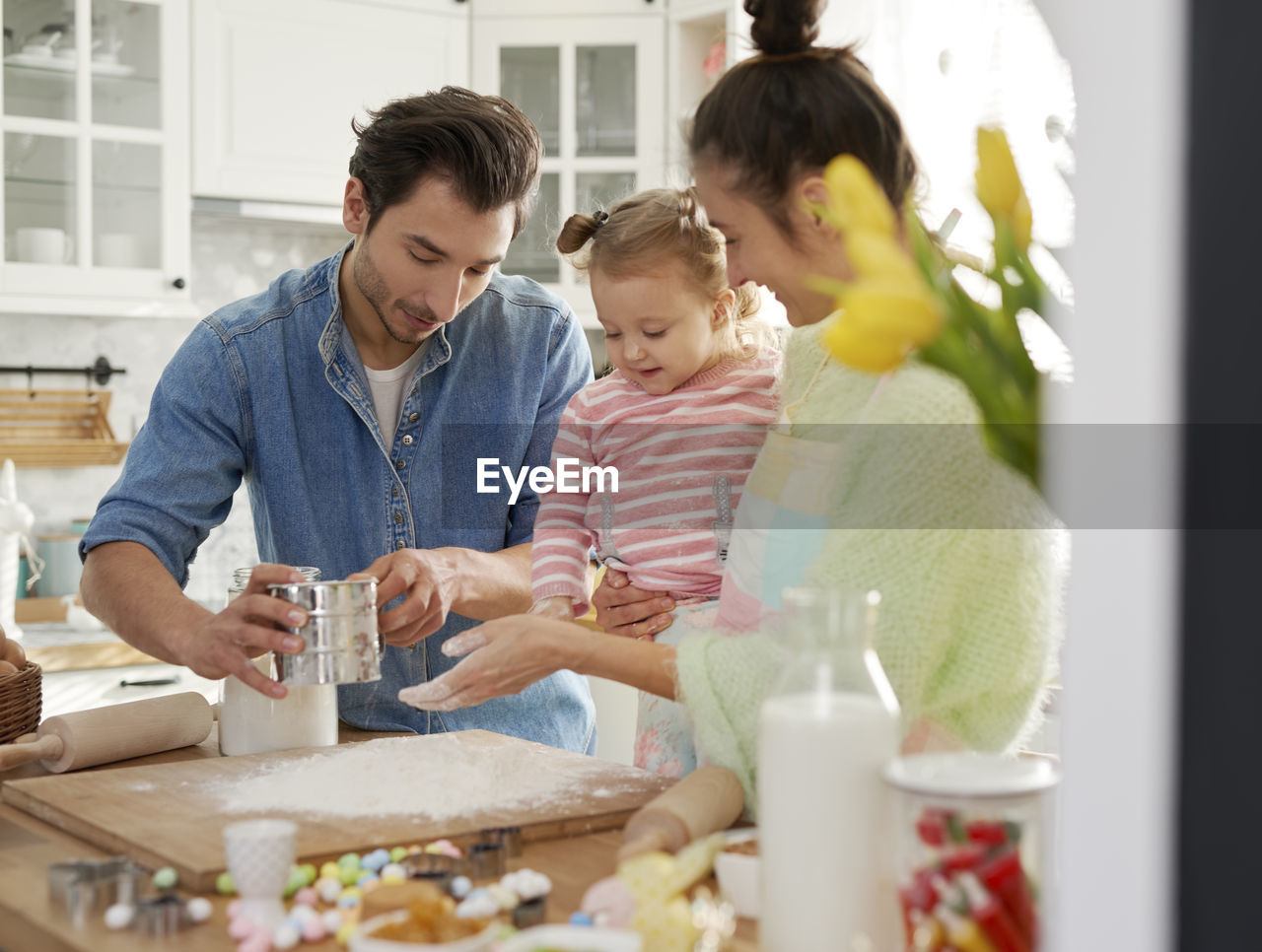 Family preparing food in kitchen