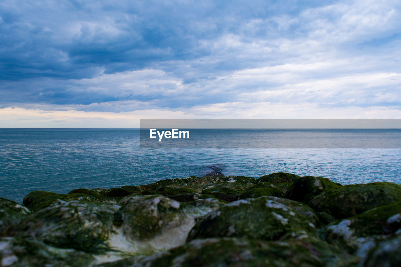 VIEW OF SEA AGAINST CLOUDY SKY