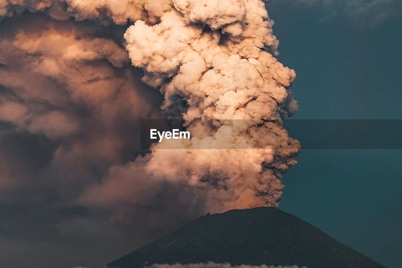 LOW ANGLE VIEW OF VOLCANIC MOUNTAIN AGAINST SKY