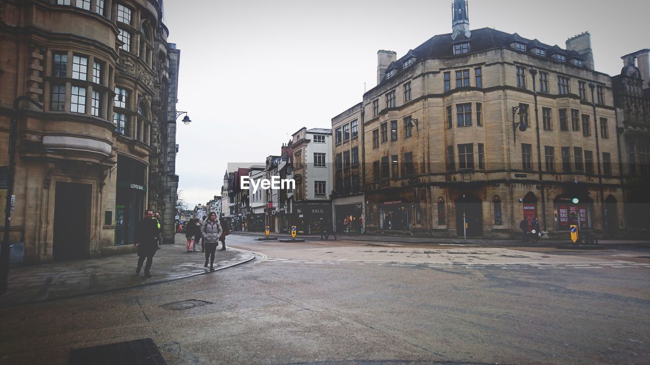 VIEW OF CITY STREET AGAINST SKY