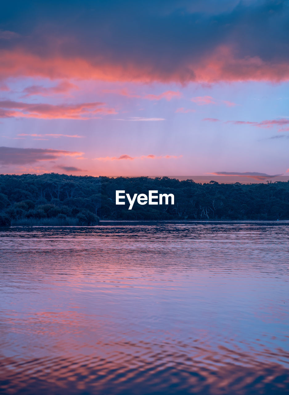 SCENIC VIEW OF SEA AGAINST ORANGE SKY