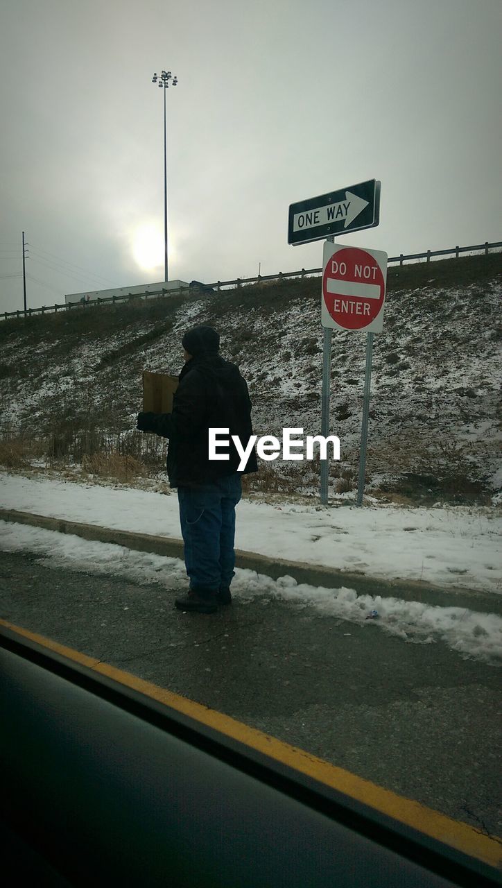 Homeless man on roadside